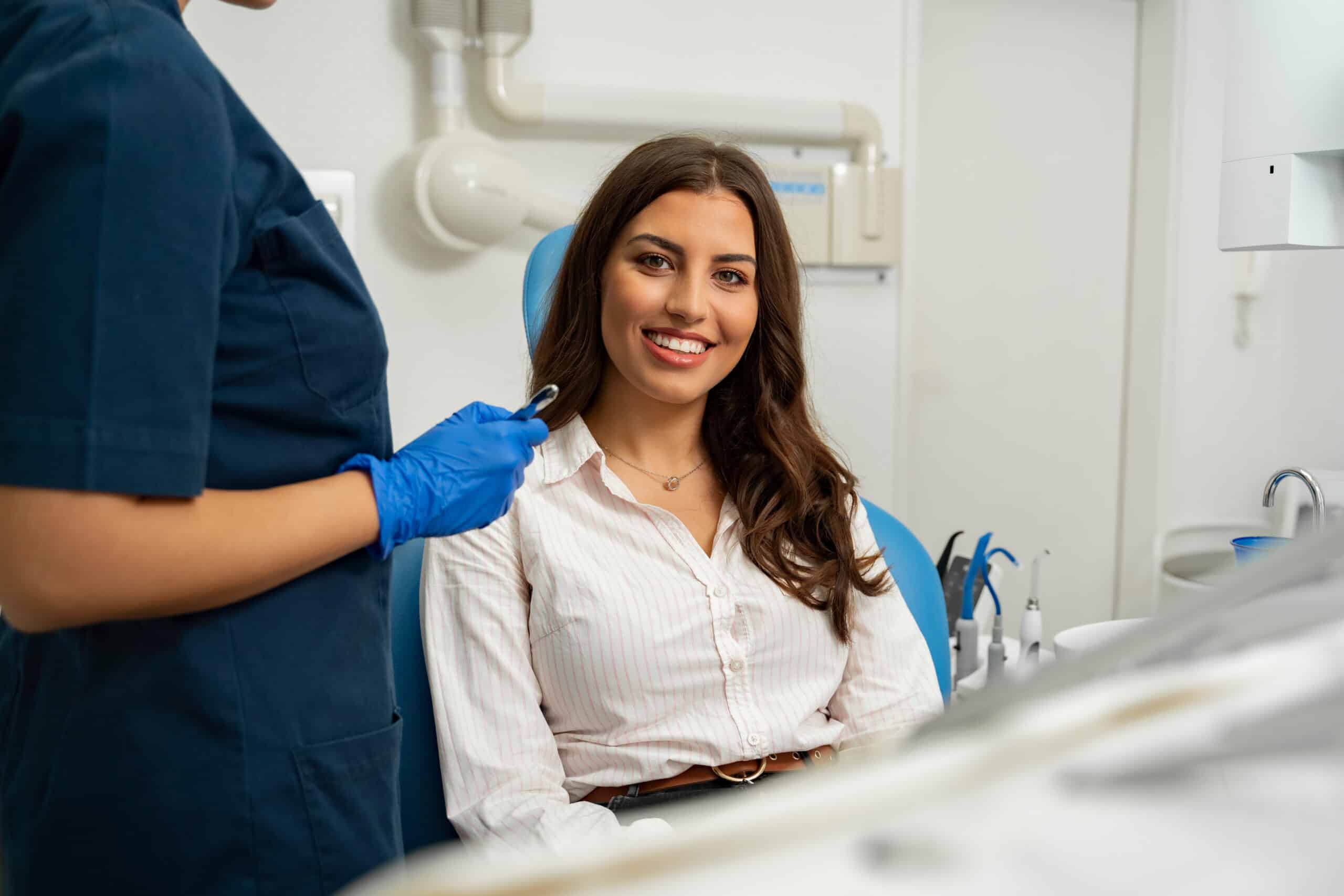 Satisfied,Patient,Sitting,In,Dentist,Chair.,Gorgeous,Young,Woman,In
