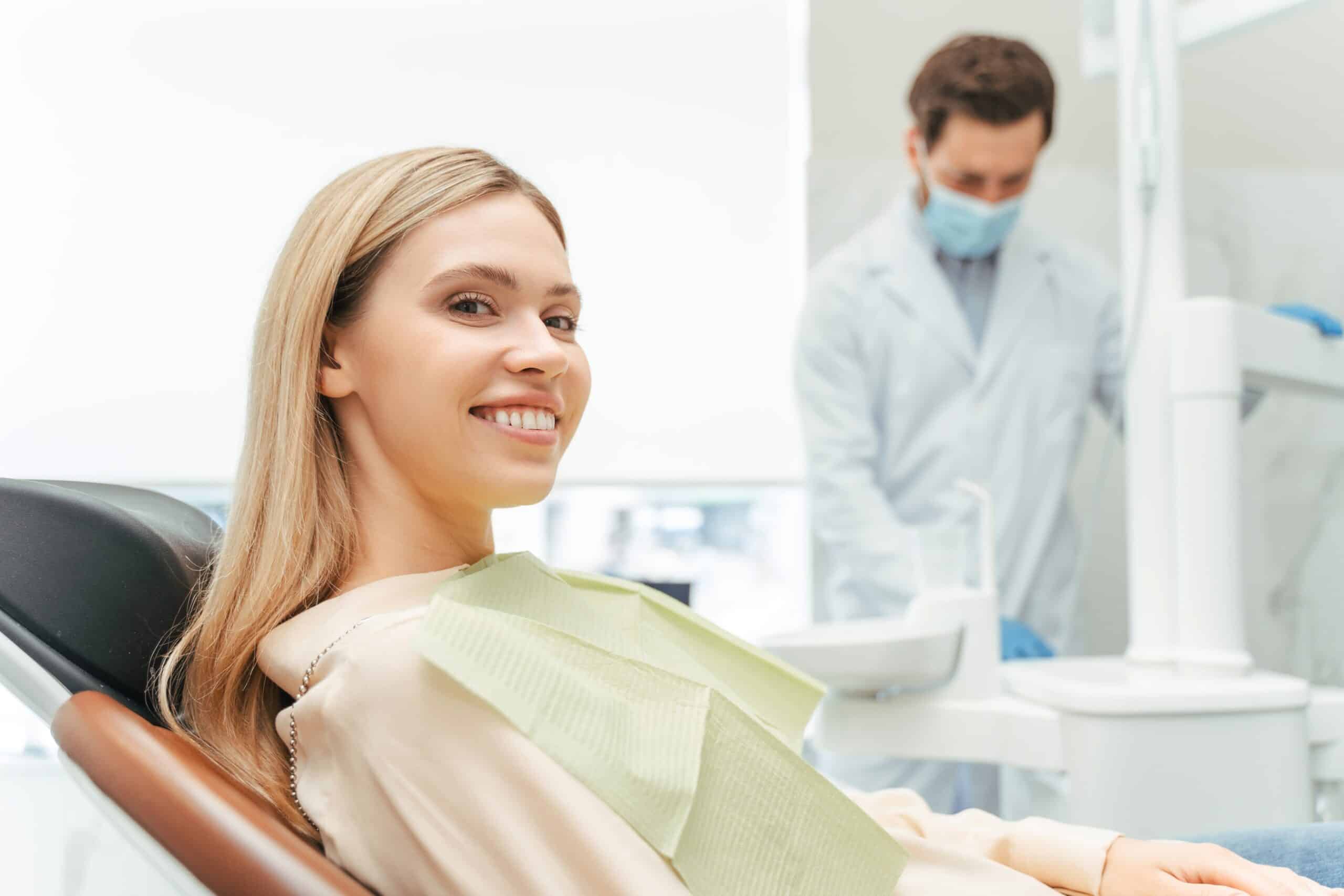 Young,Beautiful,Smiling,Woman,,Patient,Sitting,In,Modern,Dental,Clinic