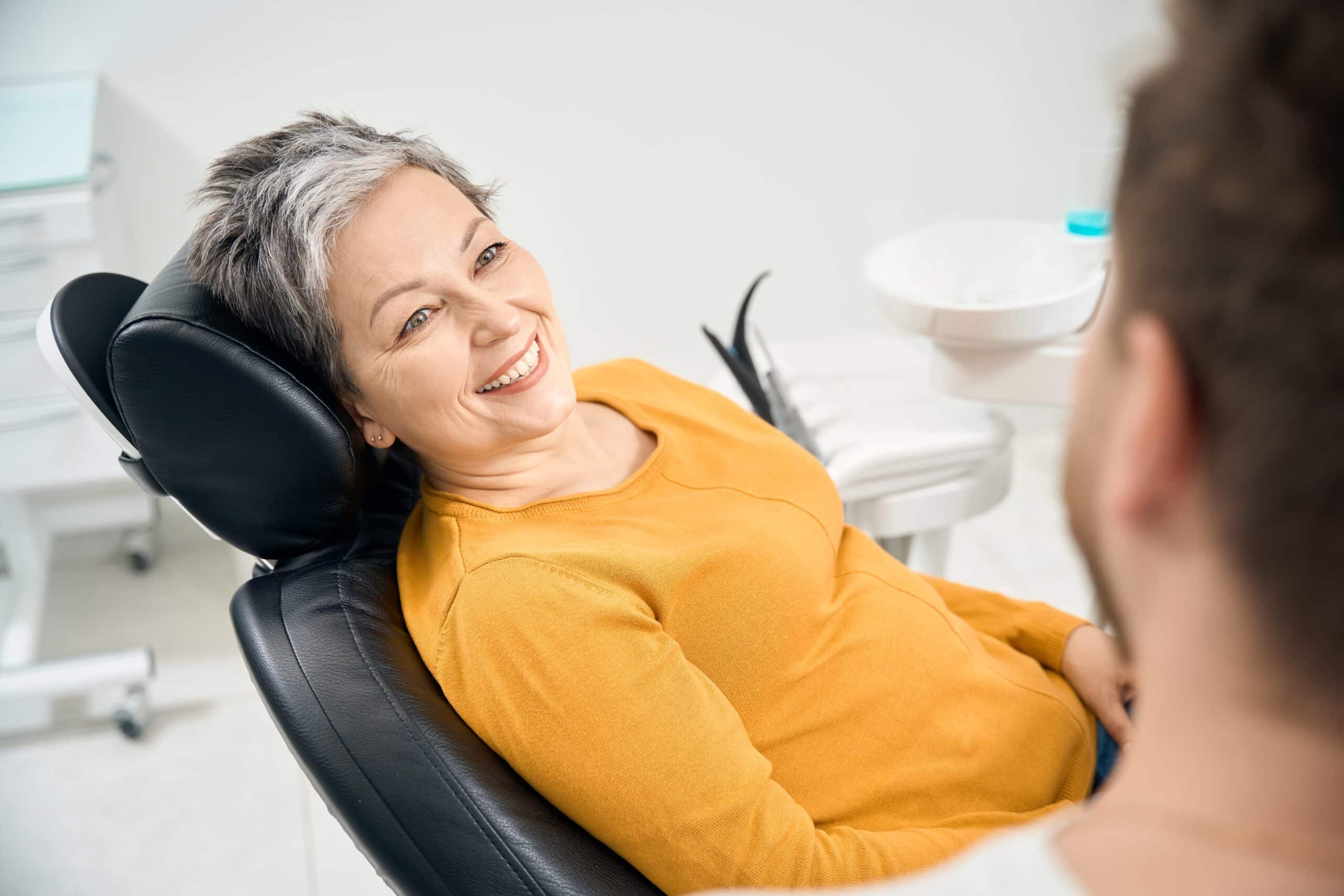 Woman,Client,In,Her,50,Looking,At,Doctor,Stomatologist,And