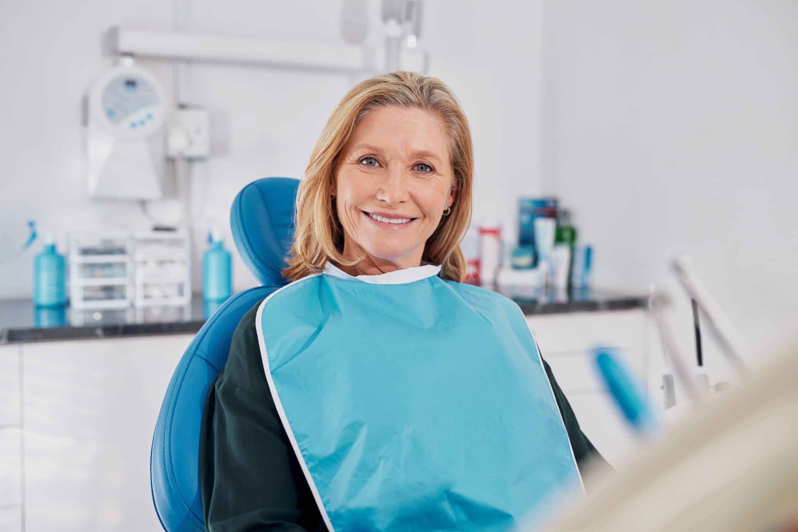 Old,Beautiful,Lady,Smiling,While,Seated,On,Dental,Chair,Wearing