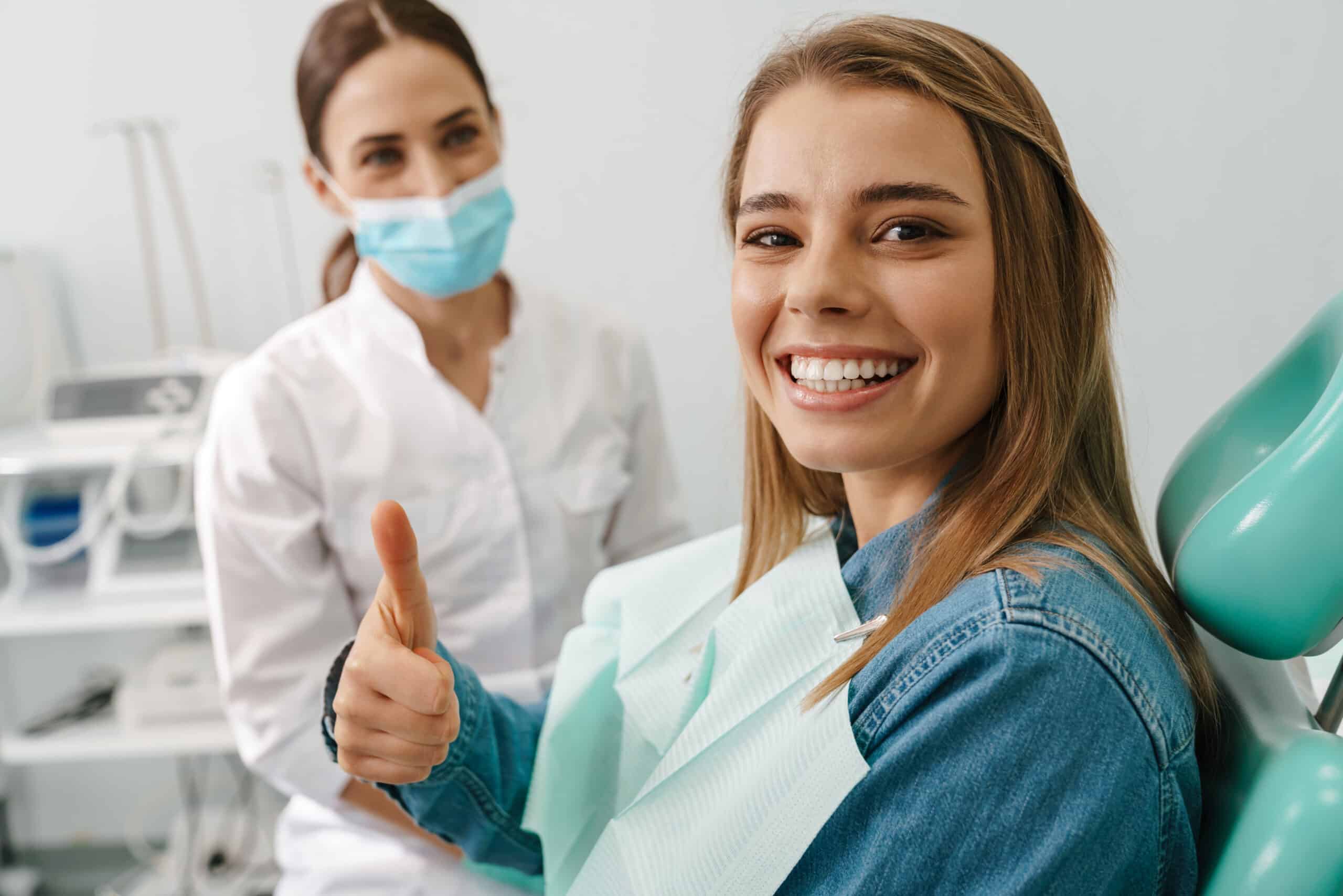European,Young,Woman,Showing,Thumb,Up,While,Sitting,In,Medical