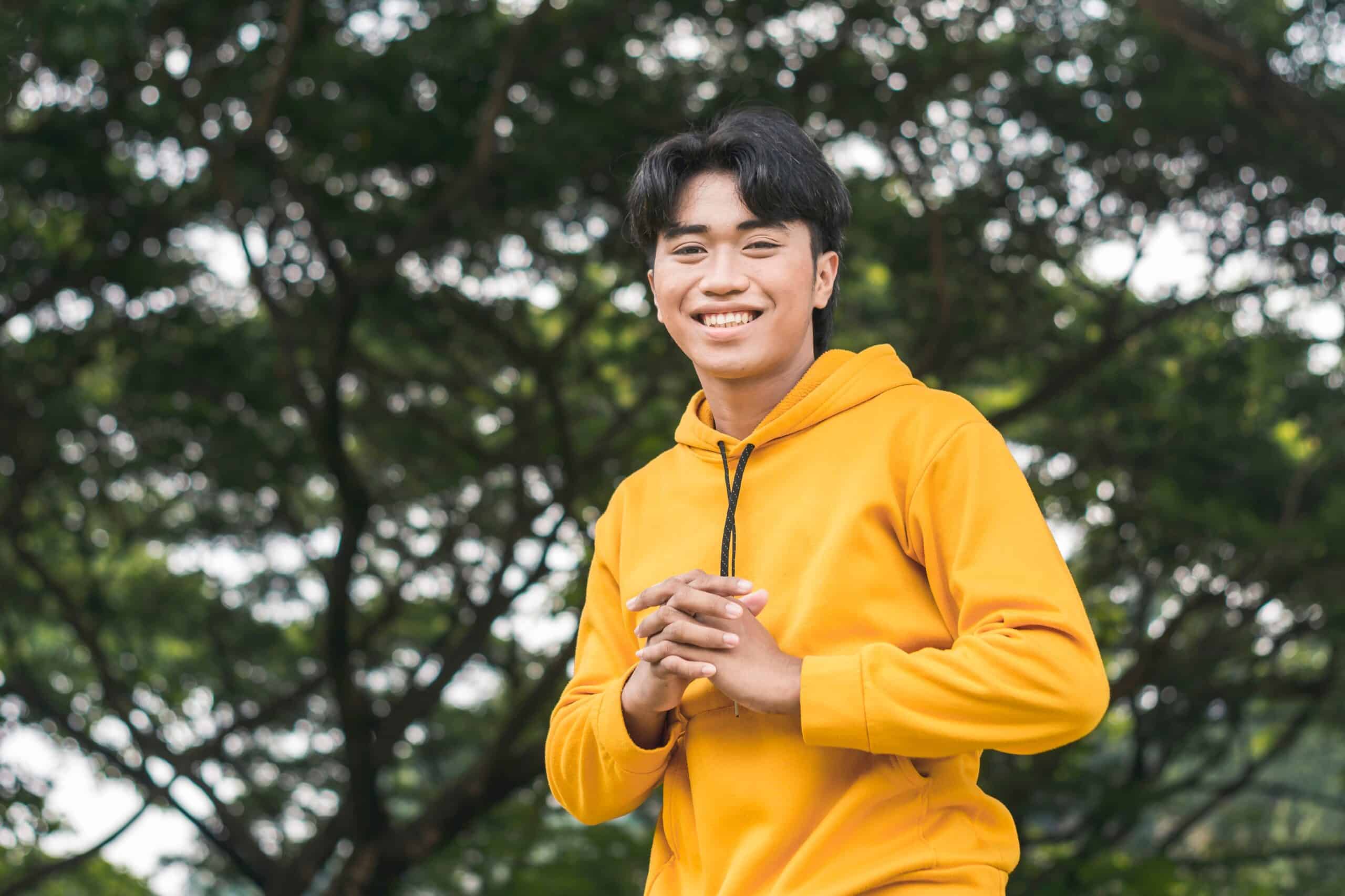 A,Friendly,Young,Man,In,A,Yellow,Hoodie,Sweater,With