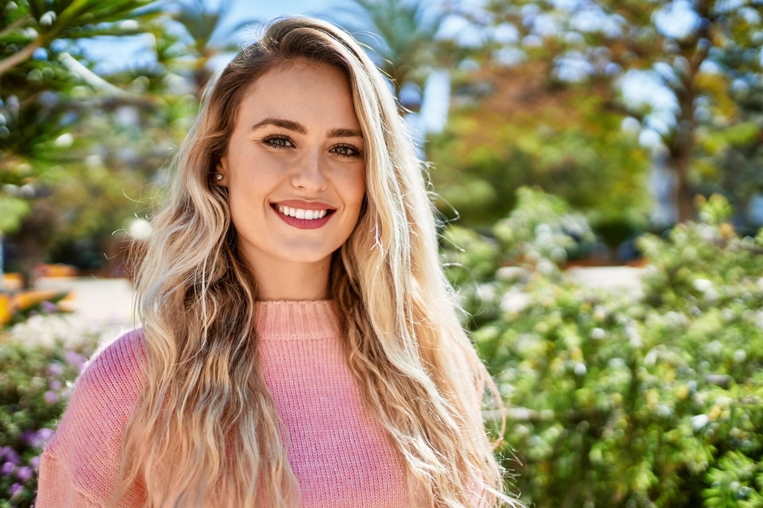 Young,Blonde,Woman,Smiling,At,The,Park
