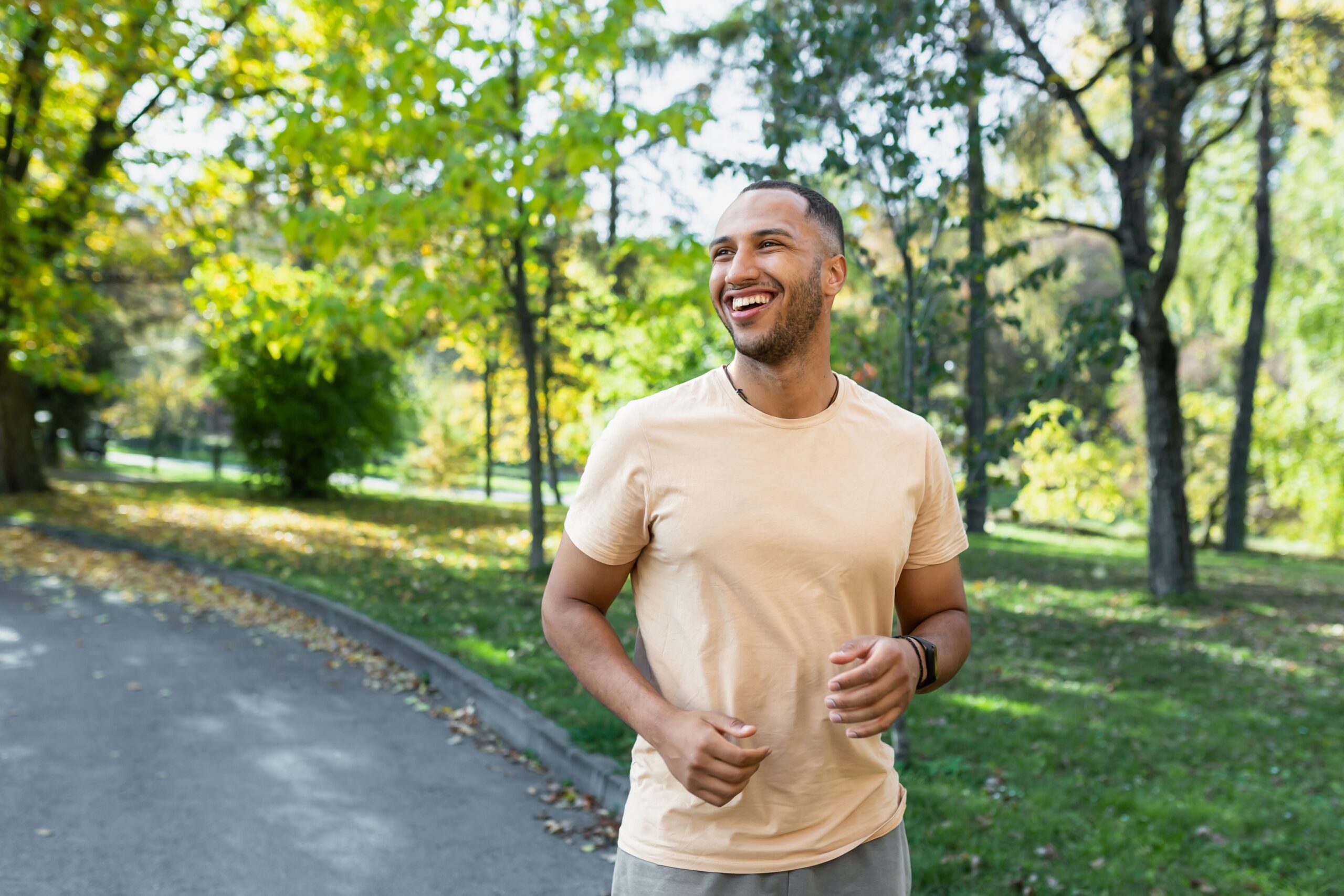 Cheerful,And,Successful,Hispanic,Man,Jogging,In,The,Park,,Man