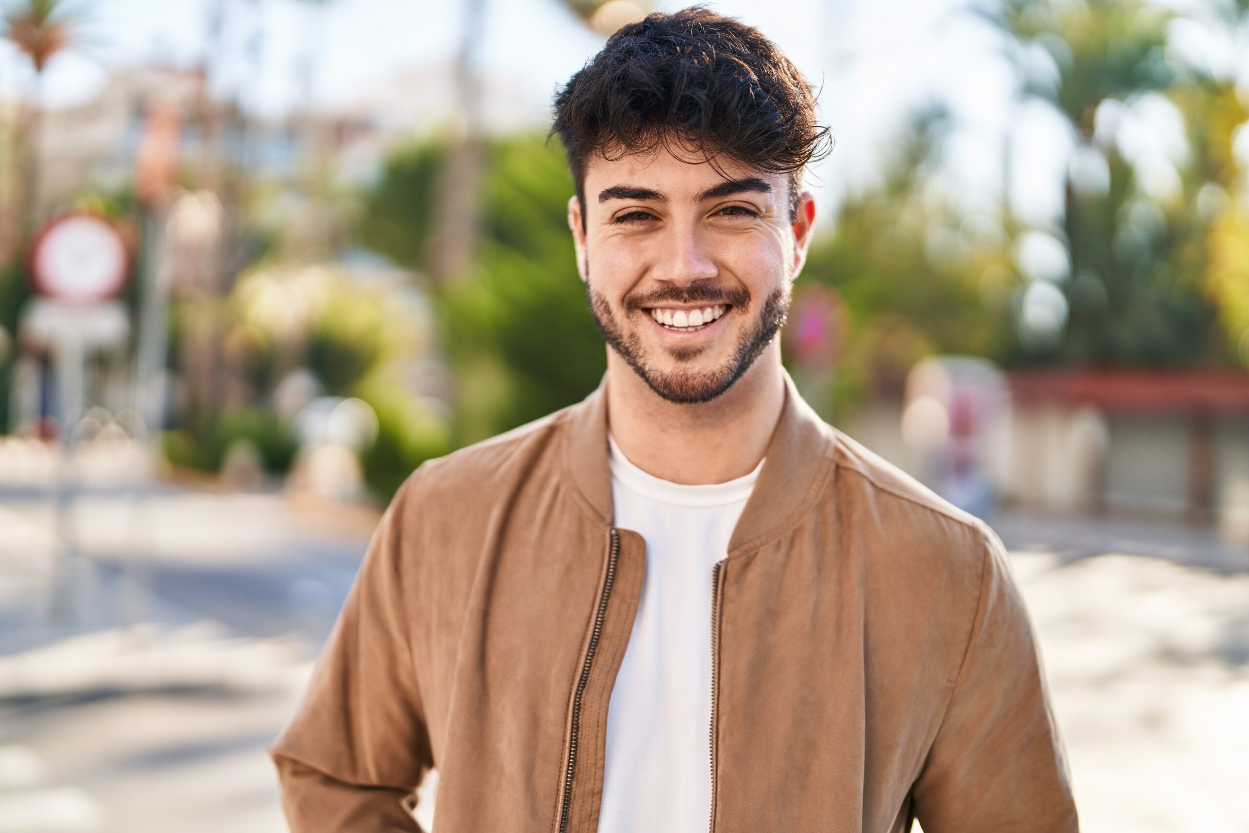 Young,Hispanic,Man,Smiling,Confident,Standing,At,Street