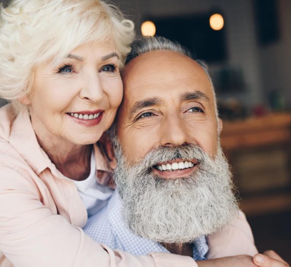 portrait-of-smiling-senior-woman-hugging-husband-i-2022-04-29-01-42-54-utc.jpg